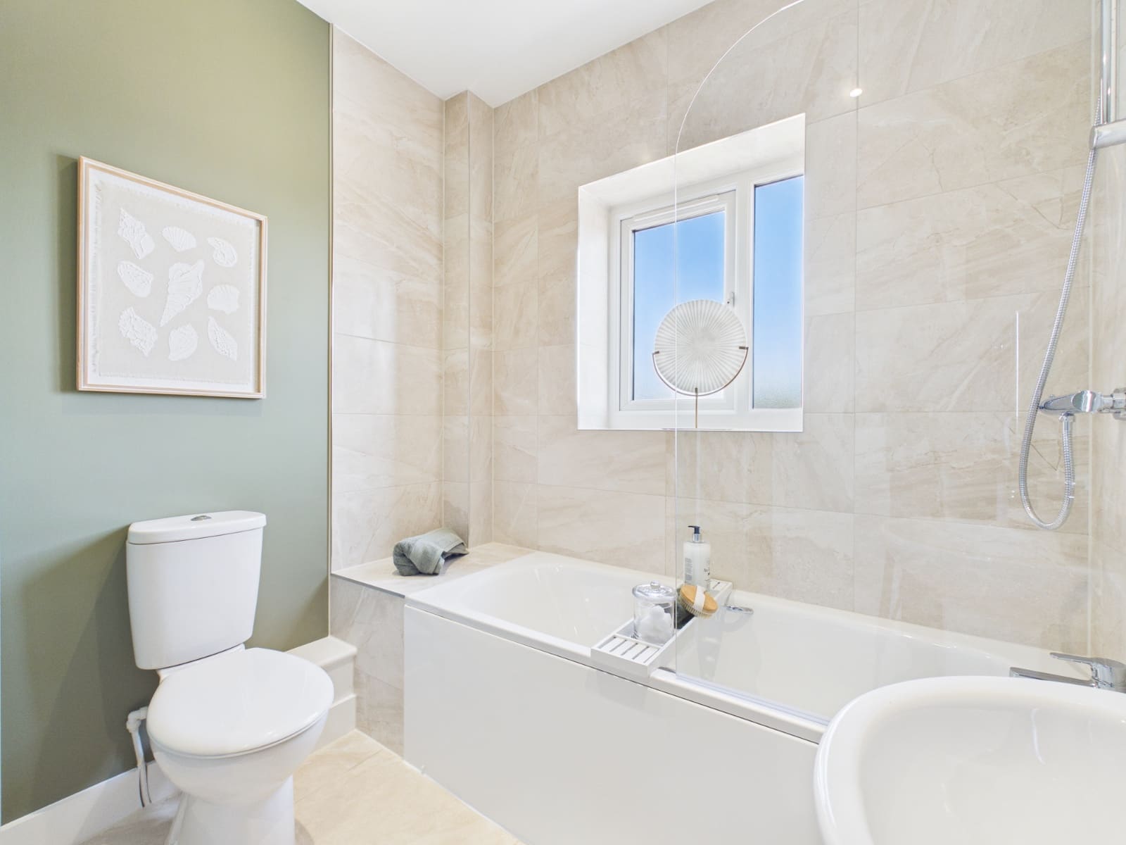 Show home bathroom finished in sage green