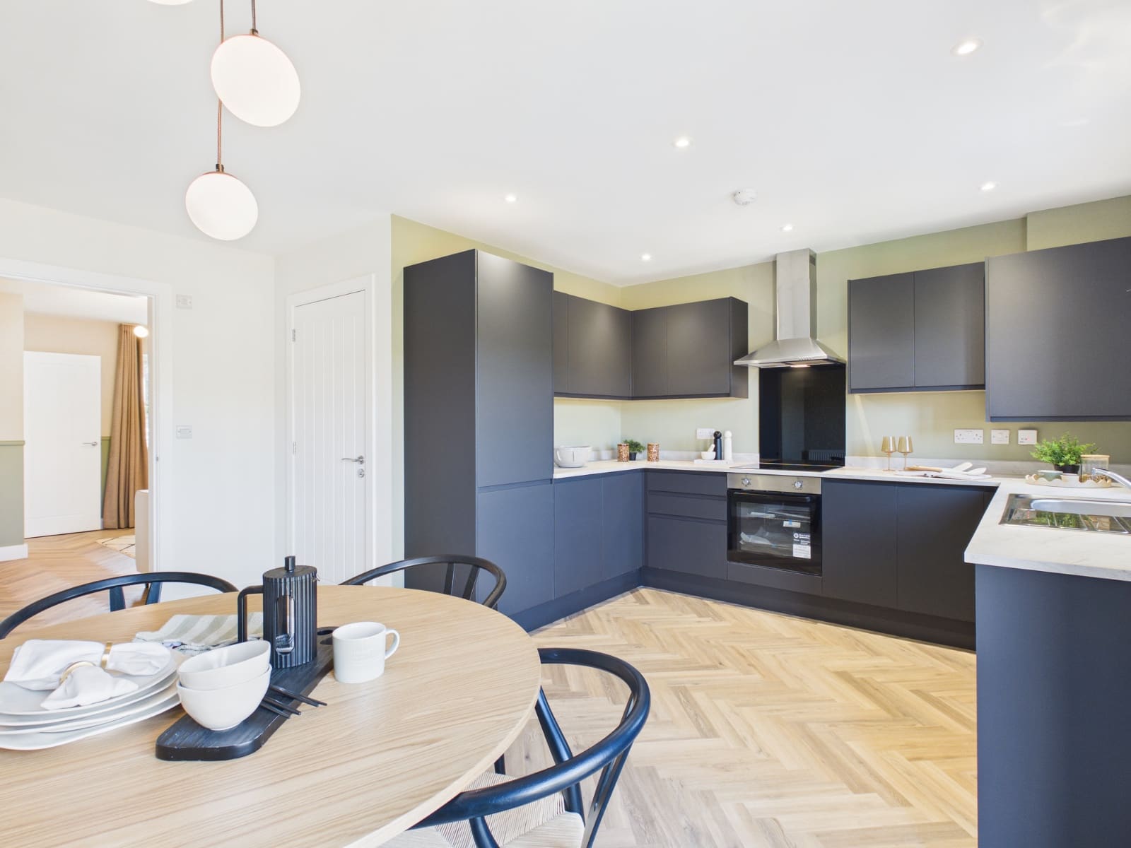 Show home kitchen with dark cabinetry